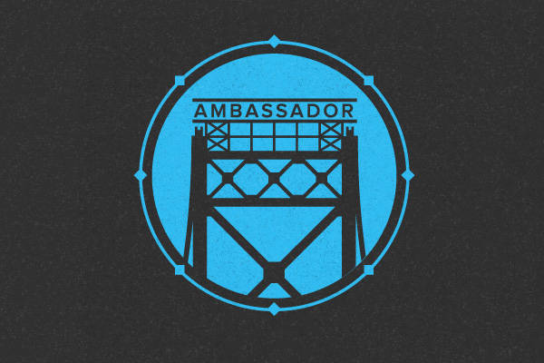 Blue and black logo featuring Detroit's Ambassador Bridge